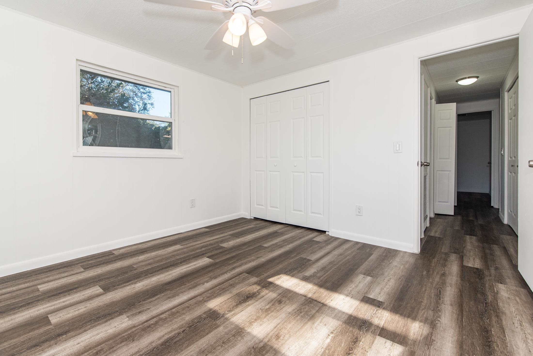 905 Palermo Road St. Augustine, FL 32086 - Photo 15 of 30 a view of a room with wooden floor and white walls