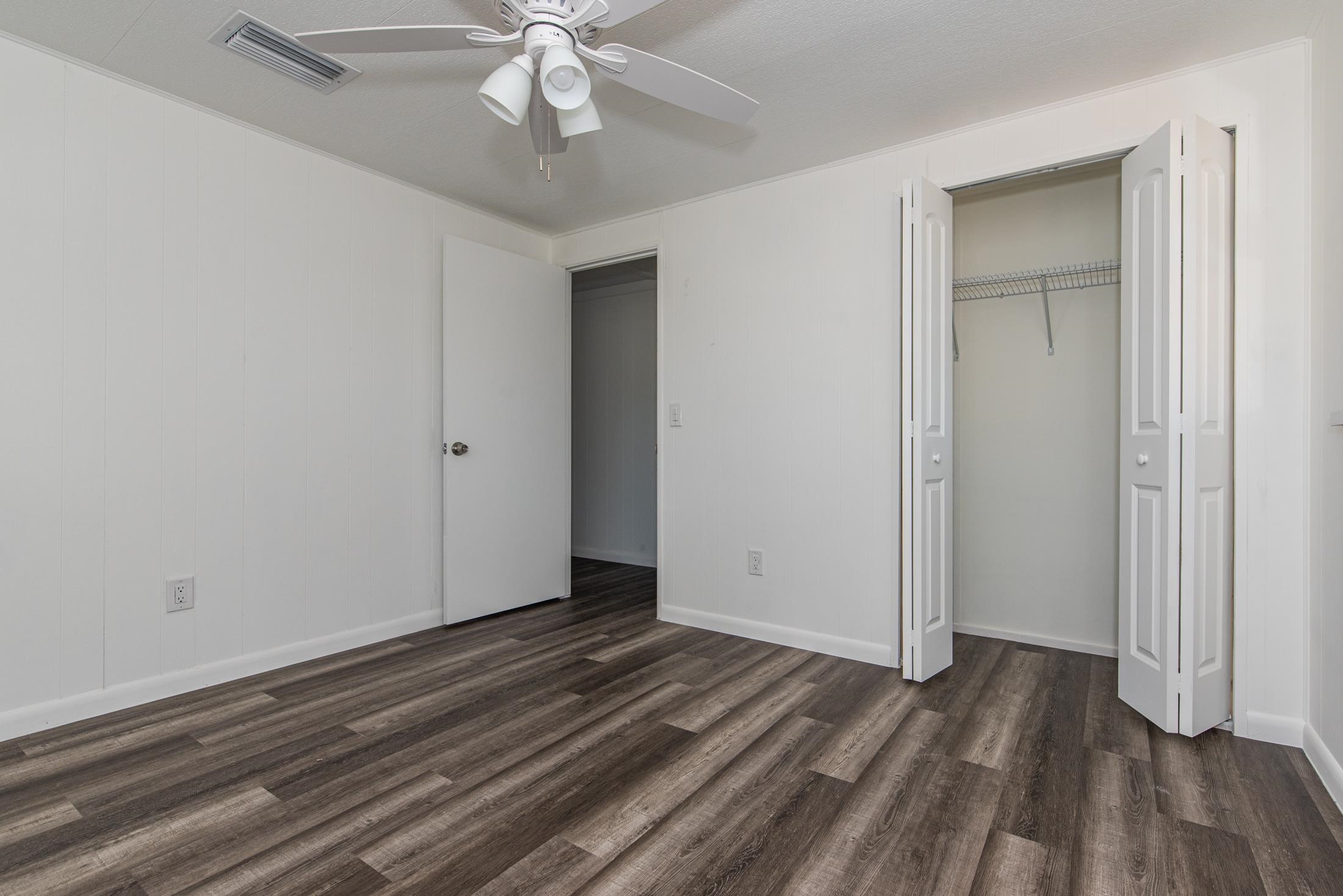 905 Palermo Road St. Augustine, FL 32086 - Photo 18 of 30 a view of a room with wooden floor and ceiling fan