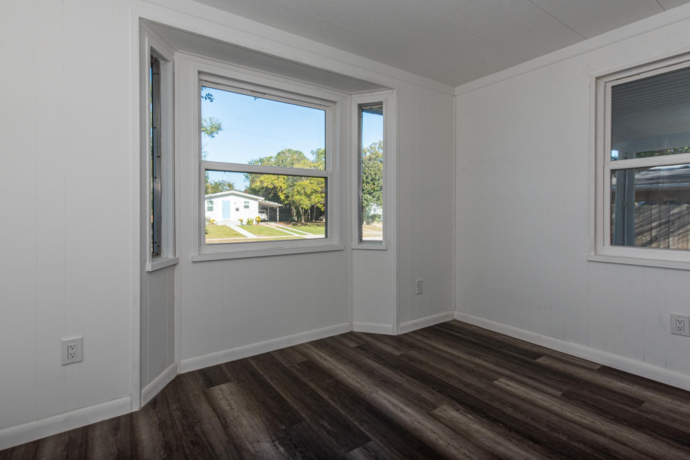 905 Palermo Road St. Augustine, FL 32086 - Photo 5 of 30 a view of empty room with wooden floor and fan