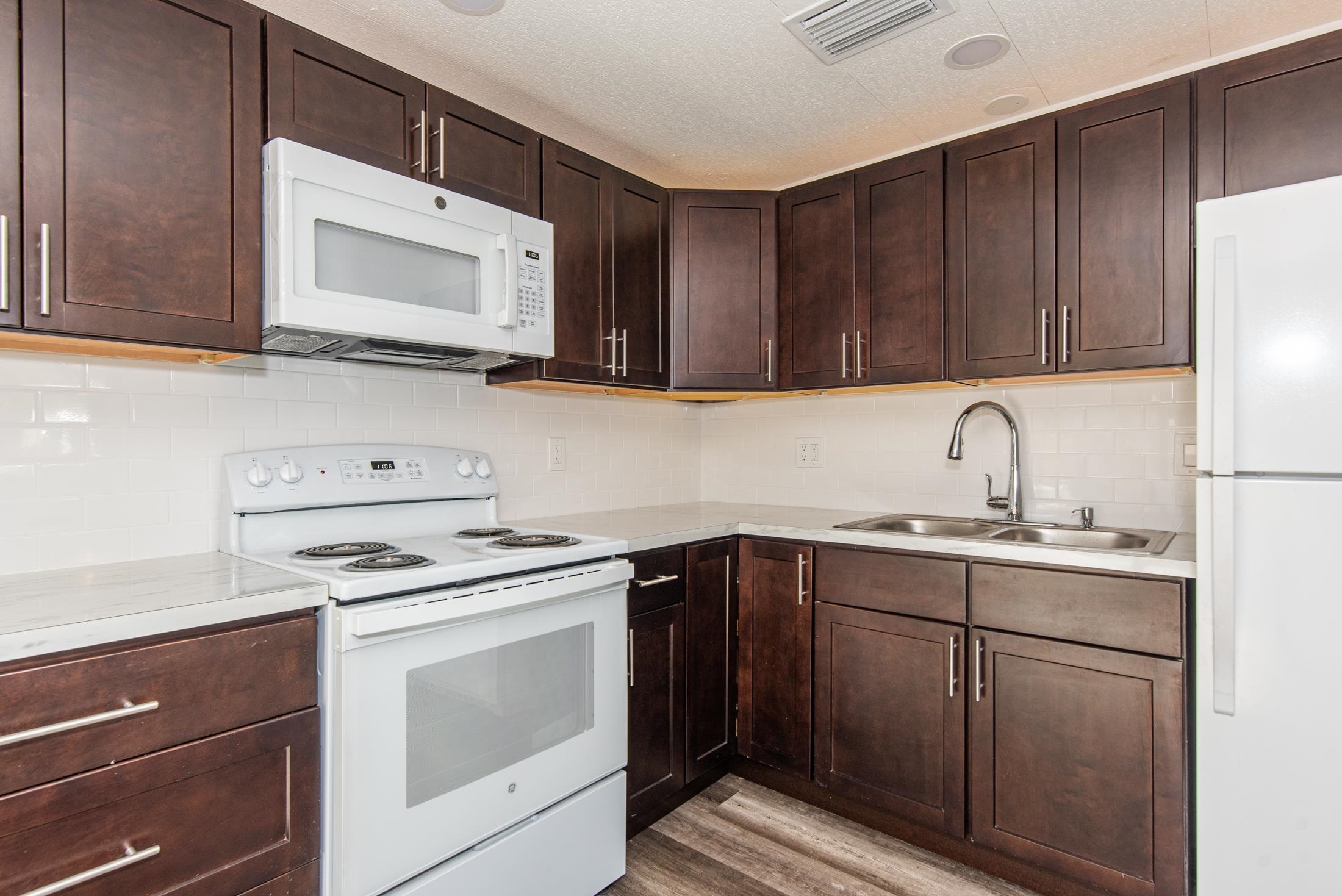 905 Palermo Road St. Augustine, FL 32086 - Photo 8 of 30 a kitchen with cabinets appliances a sink and a microwave