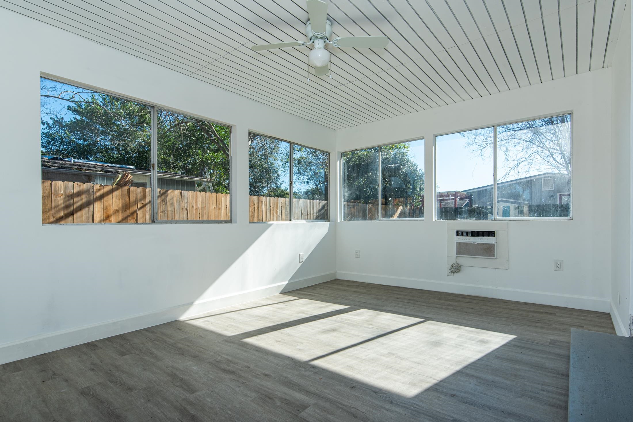905 Palermo Road St. Augustine, FL 32086 - Photo 10 of 30 an empty room with wooden floor and windows