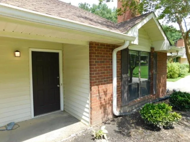 a front view of a house with a porch