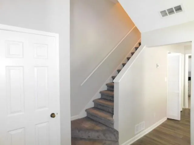 a view of entryway with wooden floor