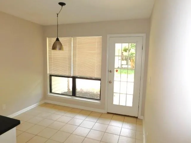 a view of an empty room and window