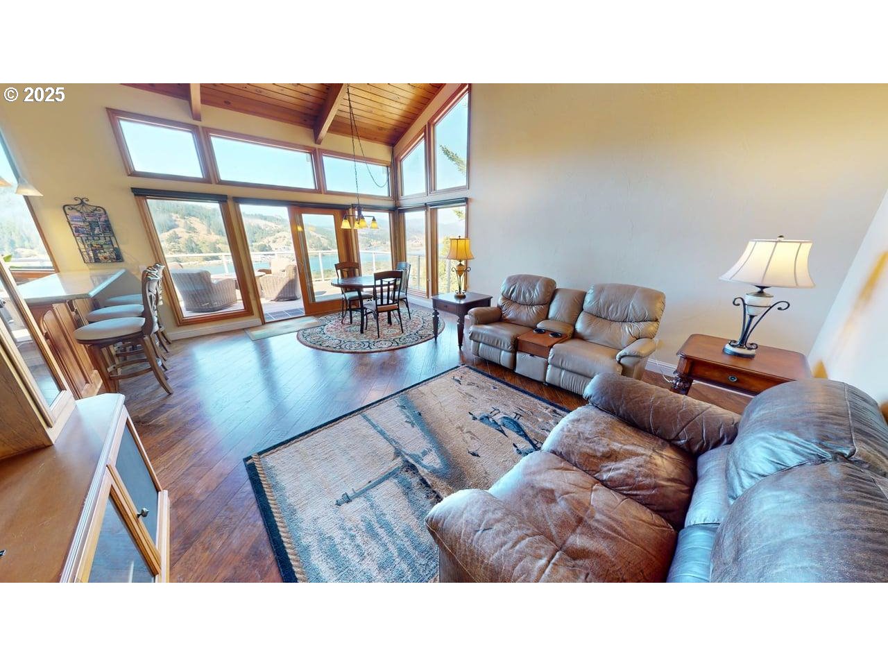 94418 Tom Cat Hill Road Gold Beach, OR 97444 - Photo 12 of 46 a living room with furniture and a large window