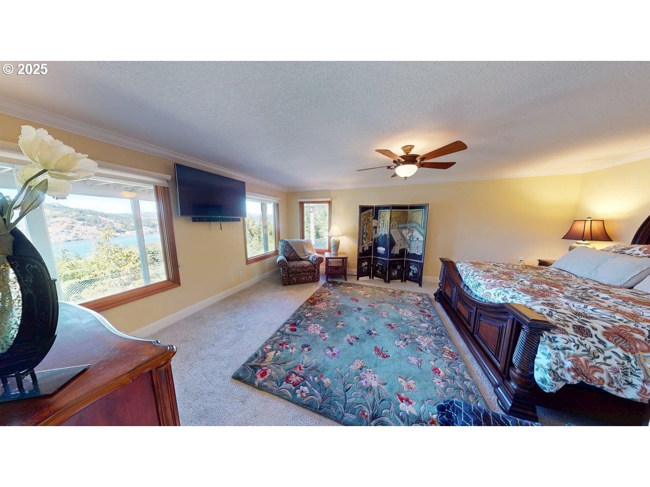 94418 Tom Cat Hill Road Gold Beach, OR 97444 - Photo 19 of 46 a living room with furniture a rug and a large window