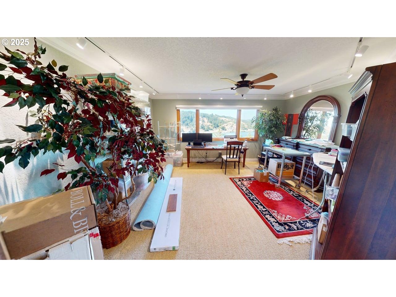 94418 Tom Cat Hill Road Gold Beach, OR 97444 - Photo 24 of 46 a living room with furniture a chandelier and a rug