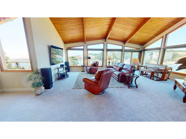 a room with furniture and a large window