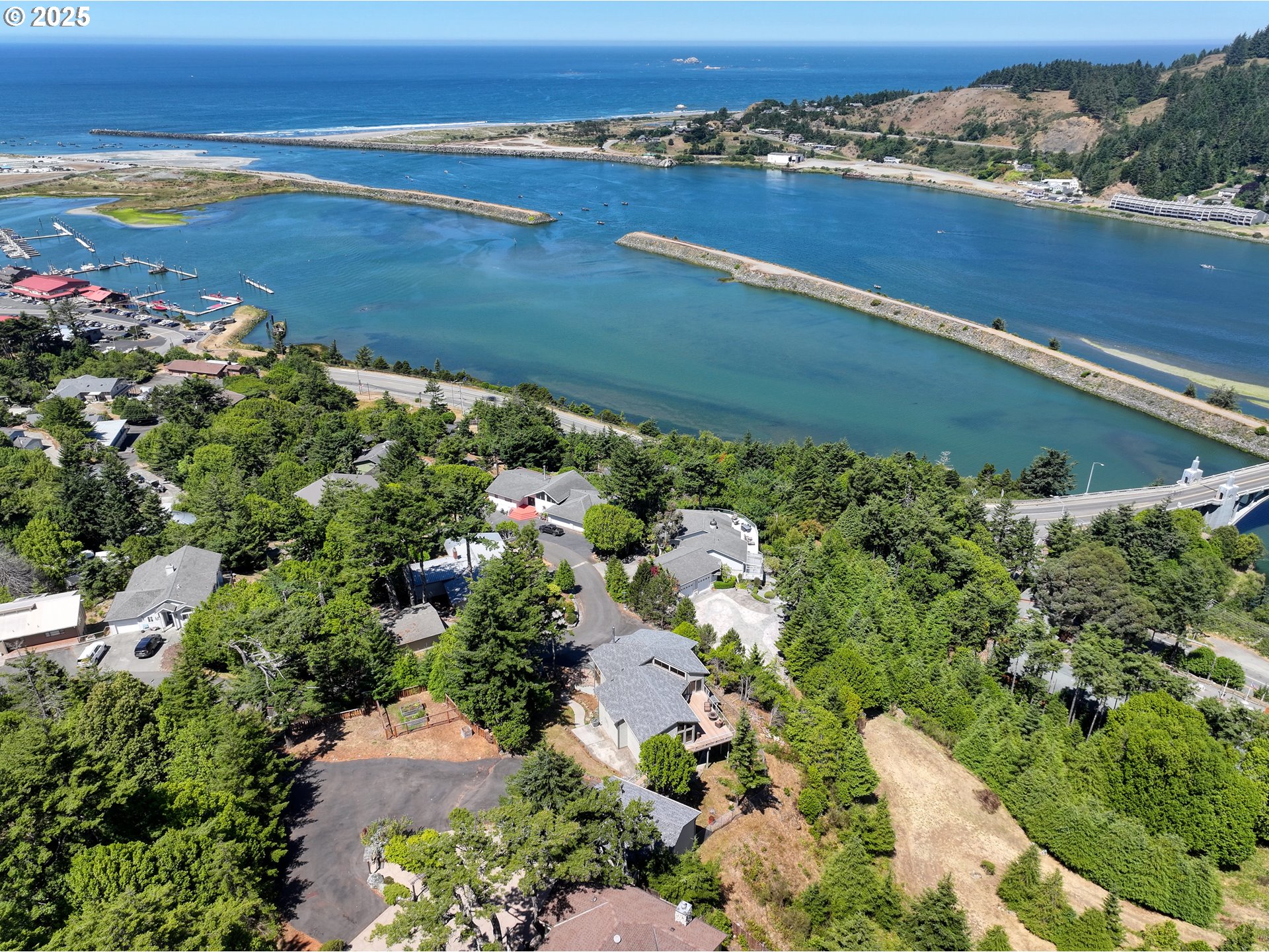 94418 Tom Cat Hill Road Gold Beach, OR 97444 - Photo 46 of 46 an aerial view of ocean and residential houses with outdoor space