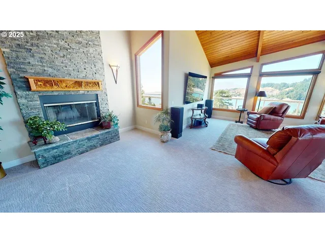 a living room with furniture a flat screen tv and a large window