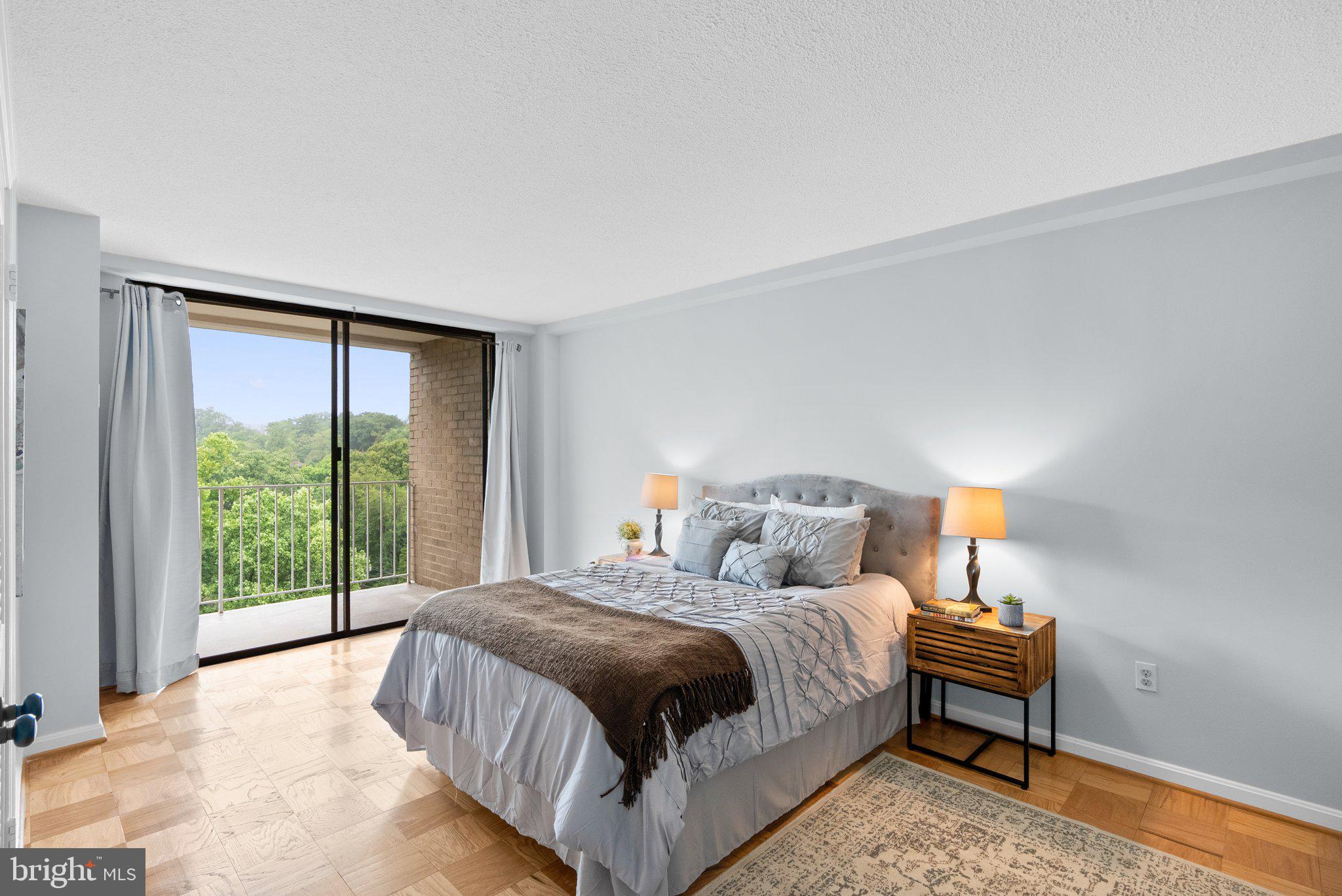 2100 Washington Avenue, Unit 10A Silver Spring, MD 20910 - Photo 14 of 26 a bedroom with a bed and a night stand