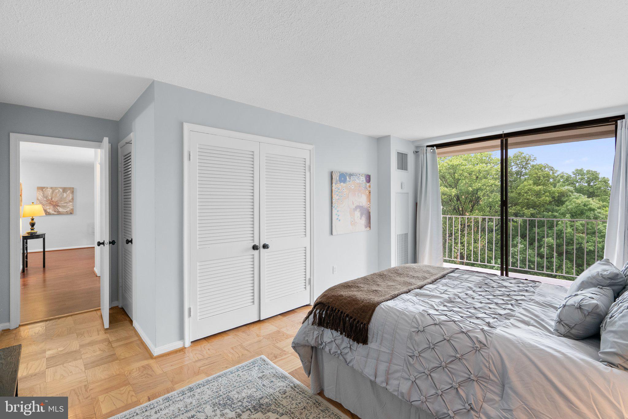 2100 Washington Avenue, Unit 10A Silver Spring, MD 20910 - Photo 15 of 26 a bedroom with a bed and a large window