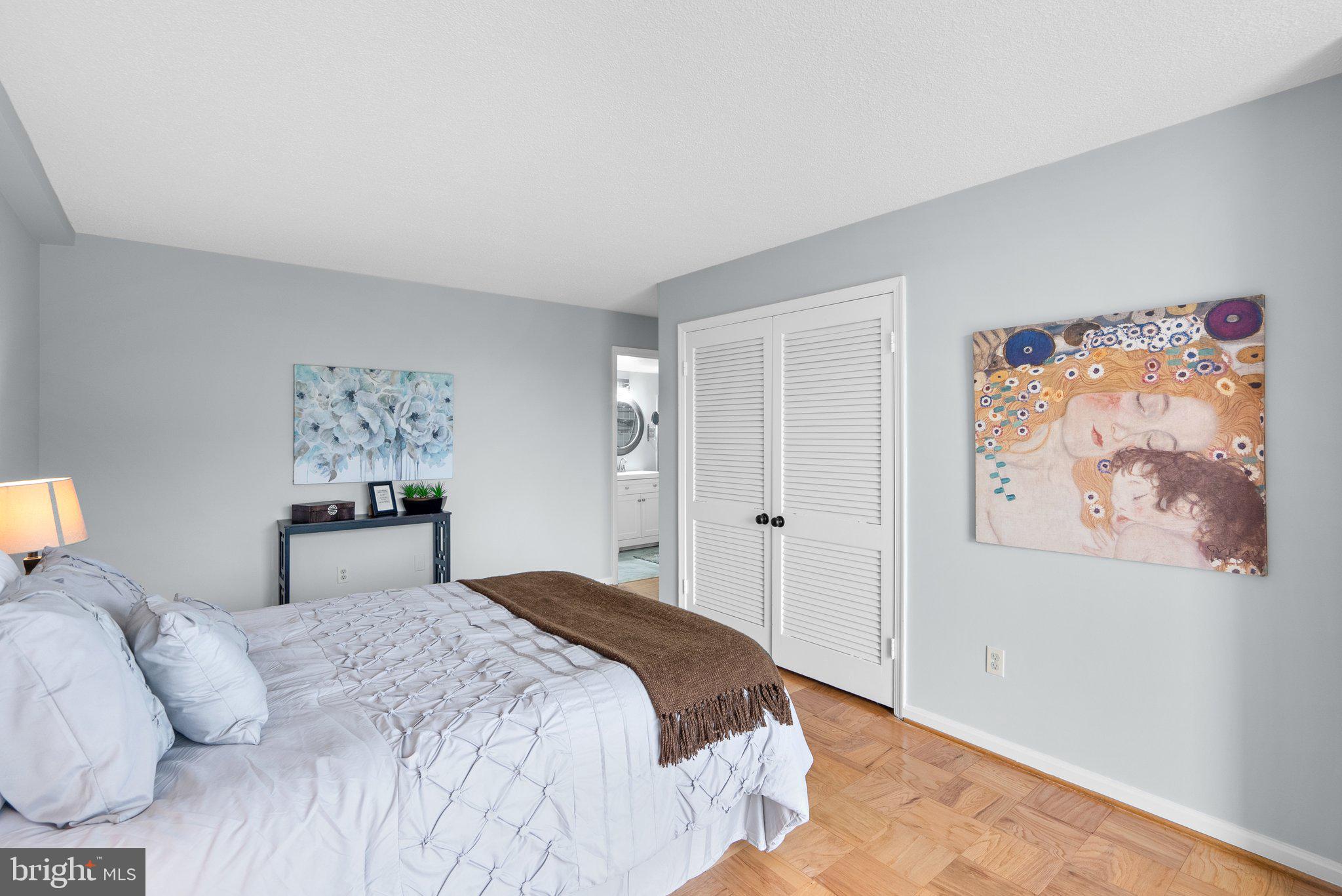 2100 Washington Avenue, Unit 10A Silver Spring, MD 20910 - Photo 16 of 26 a bedroom with a large bed and a window