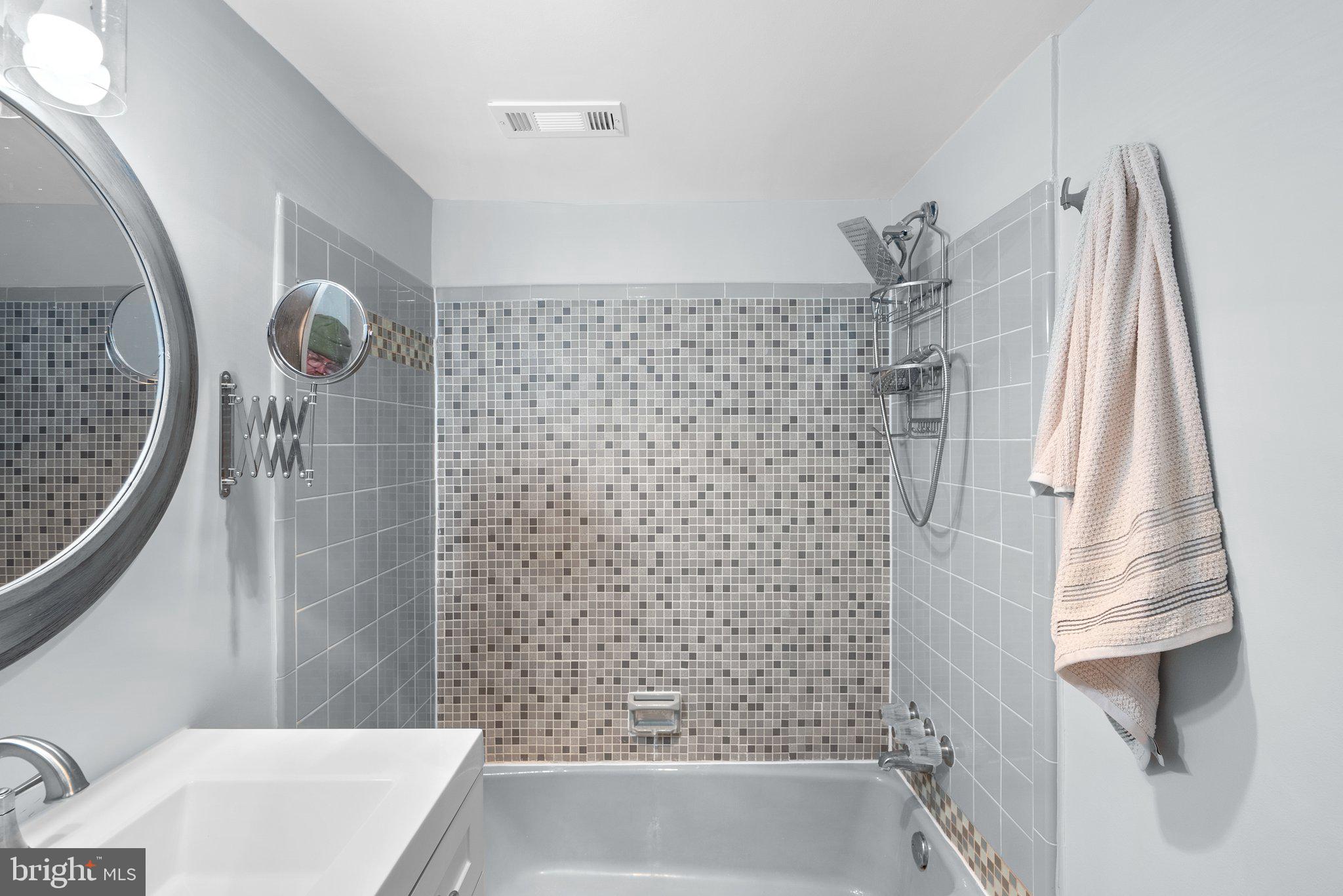 2100 Washington Avenue, Unit 10A Silver Spring, MD 20910 - Photo 19 of 26 a bathroom with a shower and a tub