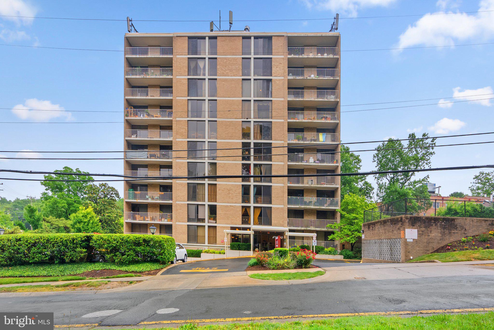 2100 Washington Avenue, Unit 10A Silver Spring, MD 20910 - Photo 2 of 26 a front view of a building with a garden and plants
