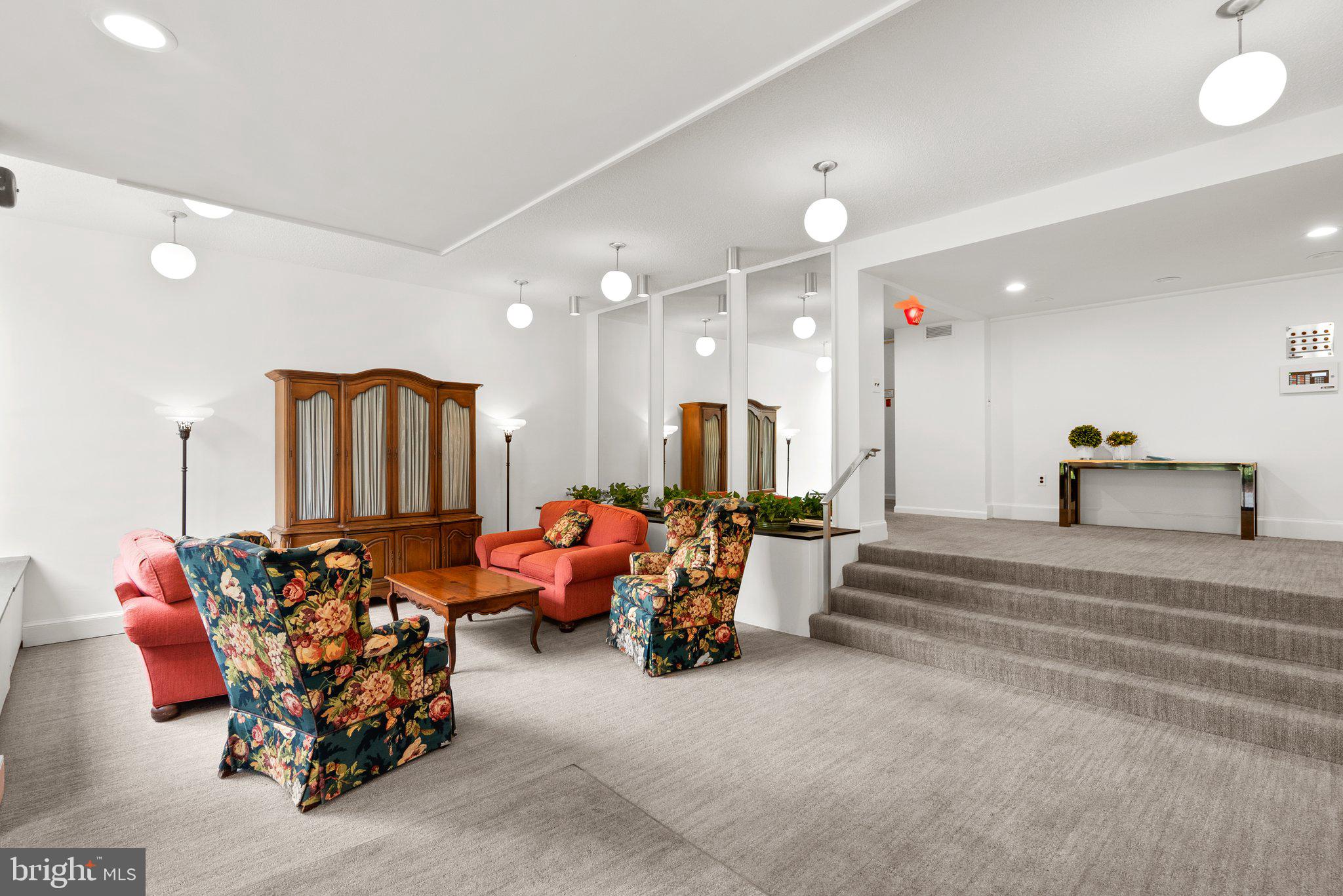 2100 Washington Avenue, Unit 10A Silver Spring, MD 20910 - Photo 4 of 26 a living room with furniture and a chandelier