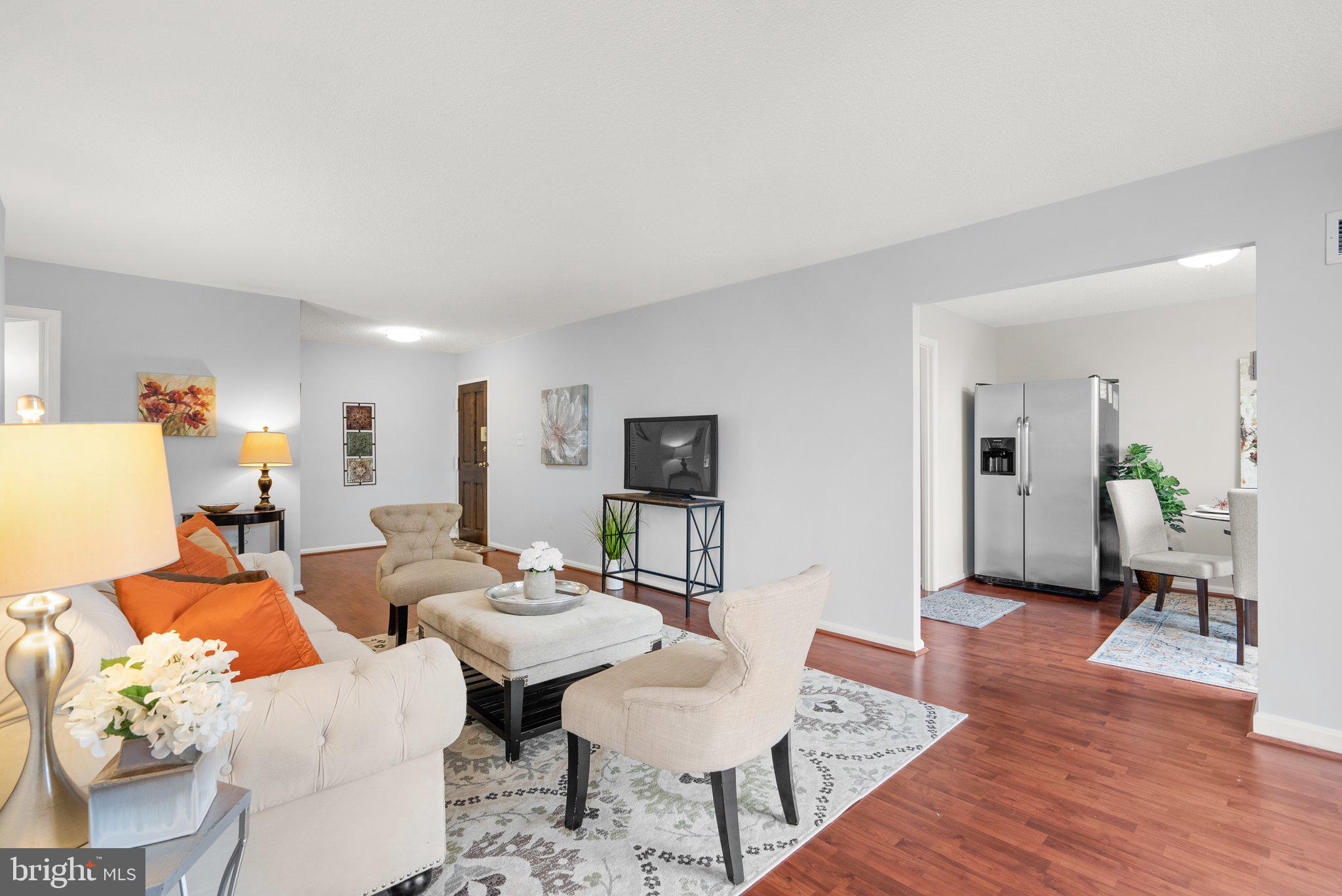 2100 Washington Avenue, Unit 10A Silver Spring, MD 20910 - Photo 8 of 26 a living room with furniture and wooden floor