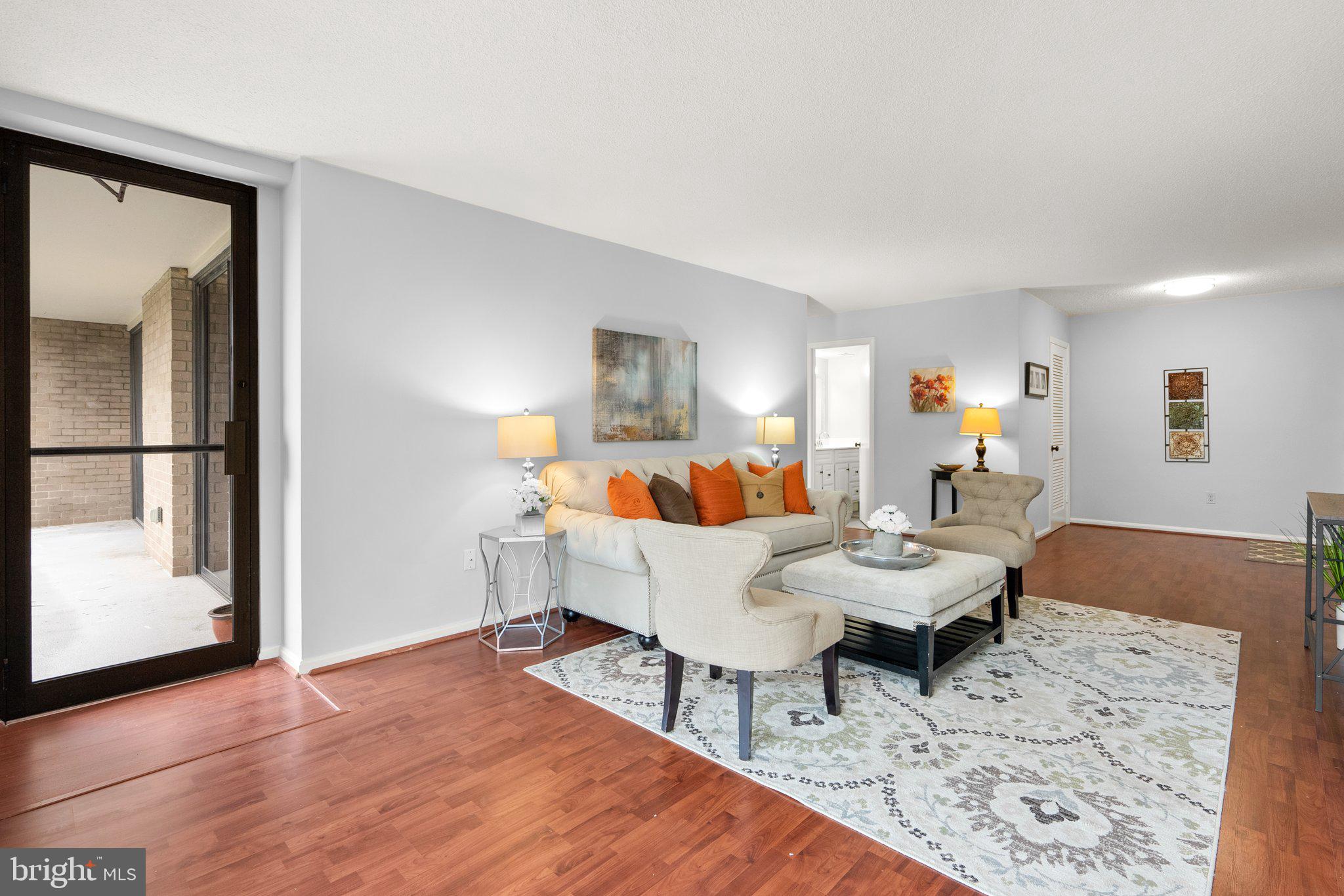 2100 Washington Avenue, Unit 10A Silver Spring, MD 20910 - Photo 9 of 26 a living room with furniture and a wooden floor