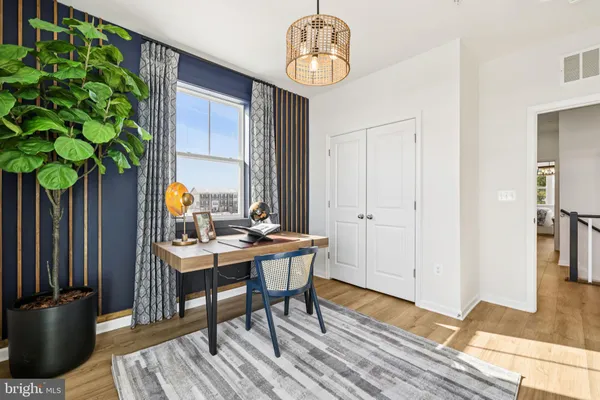 a workspace with furniture window and wooden floor