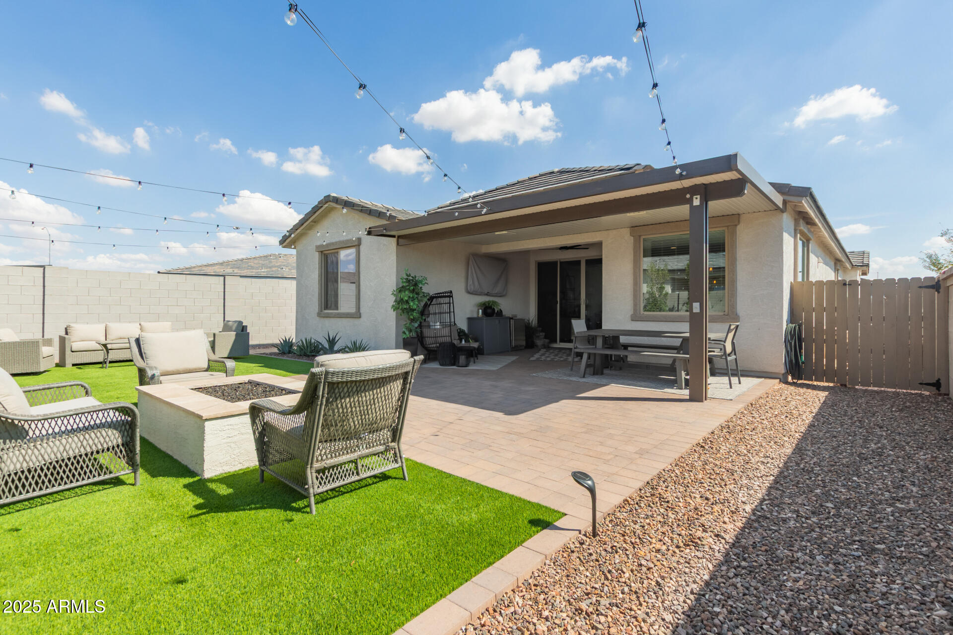 11534 East Unity Avenue Mesa, AZ 85212 - Photo 1 of 22 a view of a house with a backyard porch and sitting area