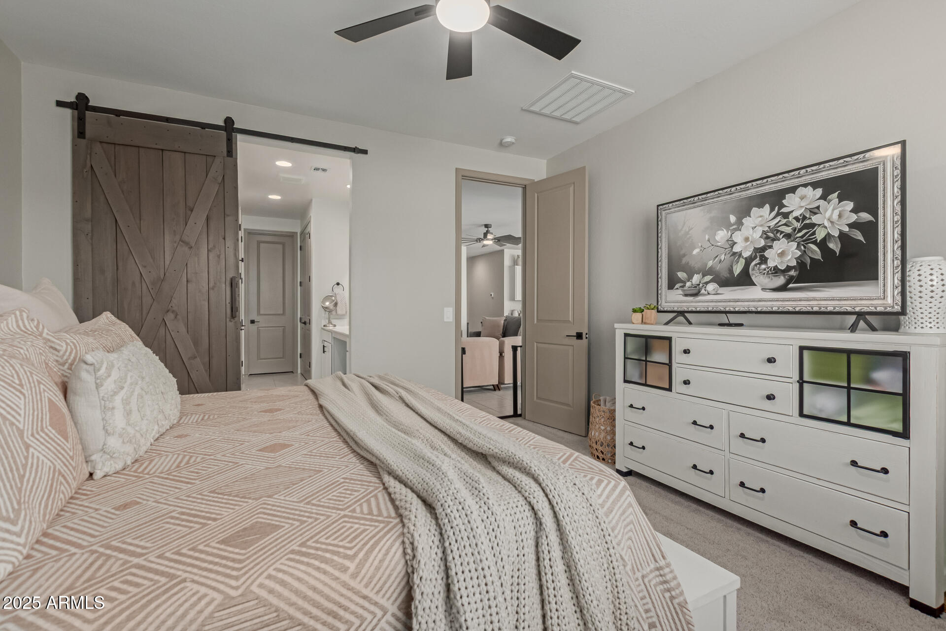 11534 East Unity Avenue Mesa, AZ 85212 - Photo 12 of 22 a bedroom with a bed and a cabinet