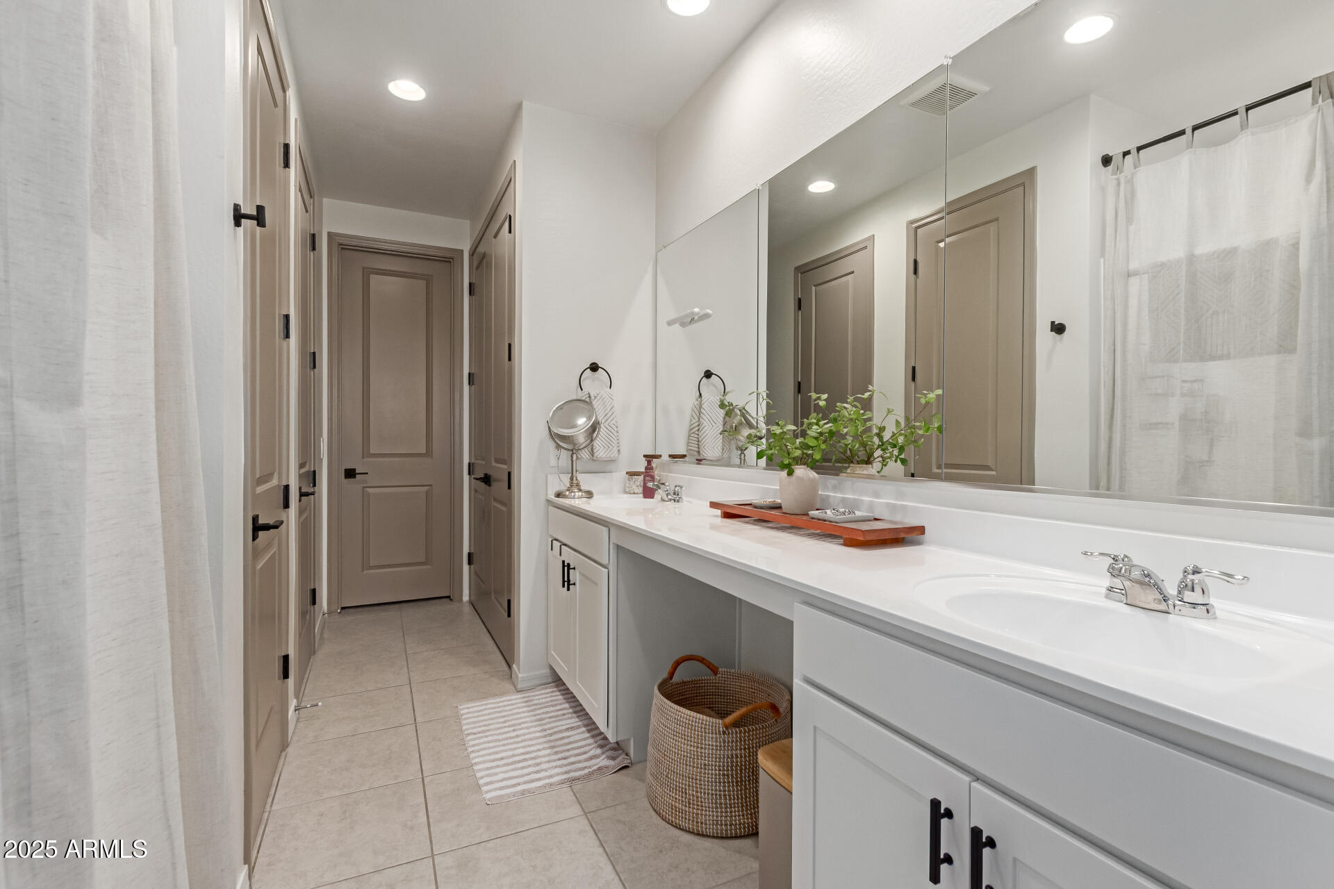 11534 East Unity Avenue Mesa, AZ 85212 - Photo 13 of 22 a bathroom with a sink and a mirror