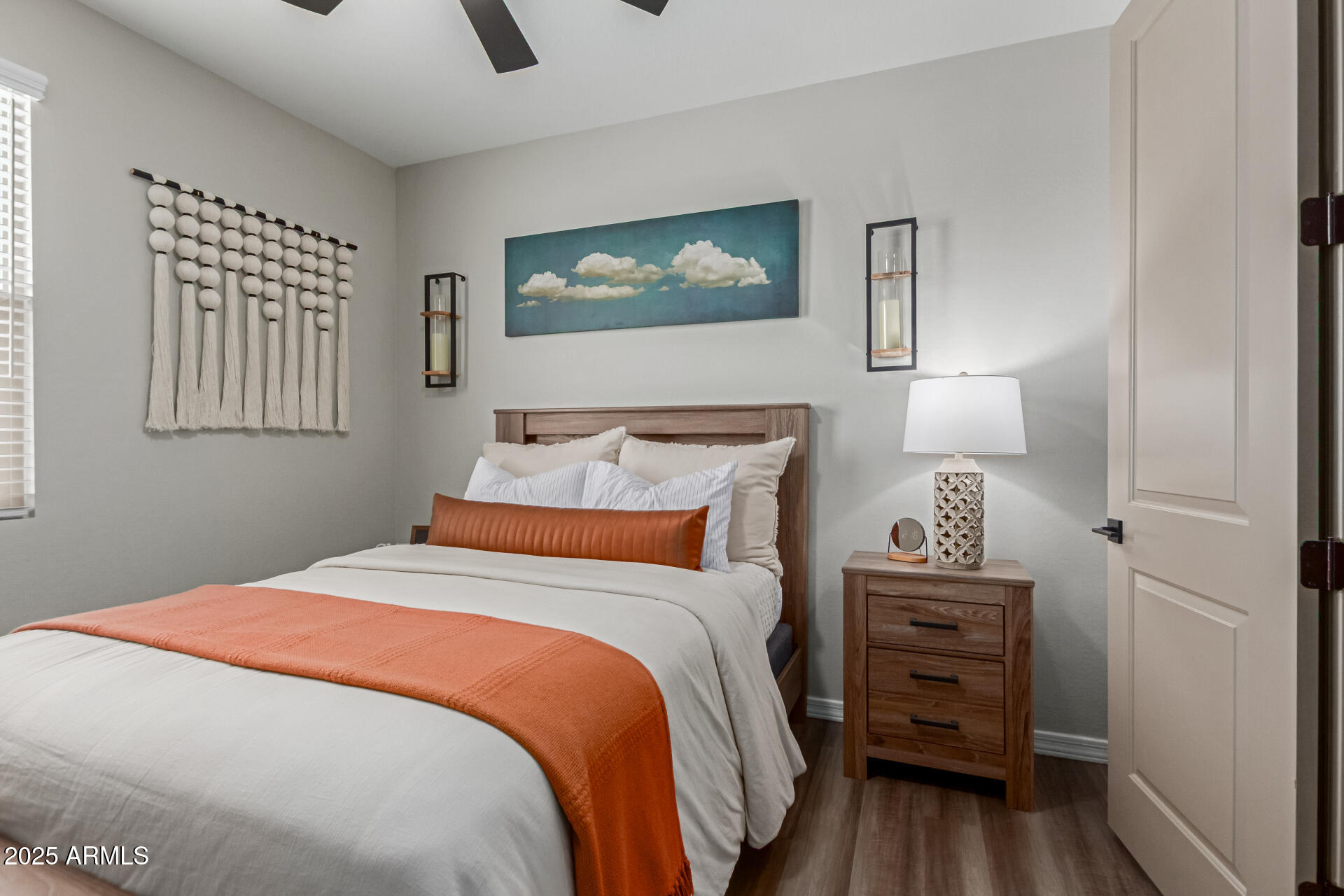 11534 East Unity Avenue Mesa, AZ 85212 - Photo 14 of 22 a bedroom with bed and wooden floor
