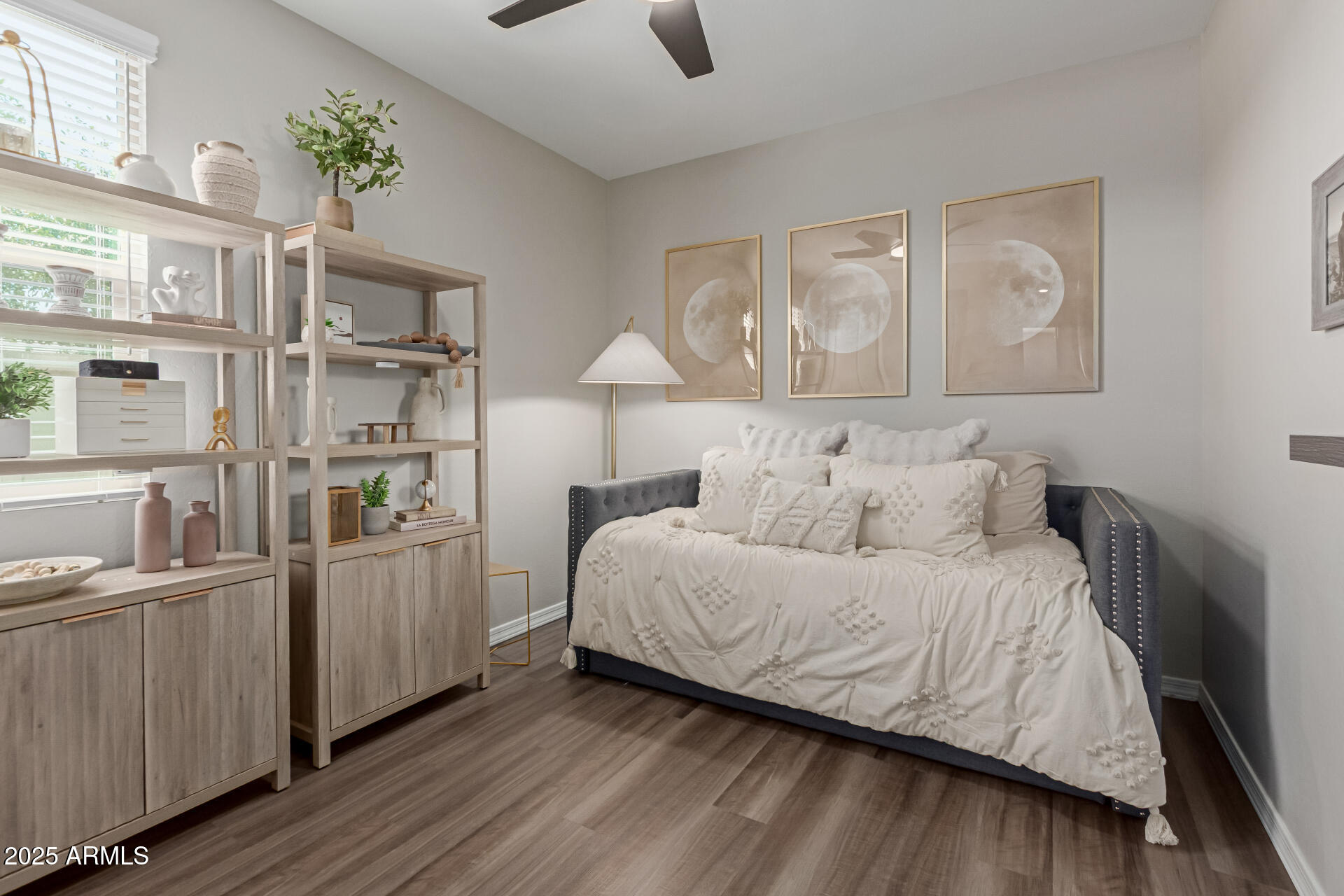 11534 East Unity Avenue Mesa, AZ 85212 - Photo 15 of 22 a bedroom with a bed and a painting on the wall
