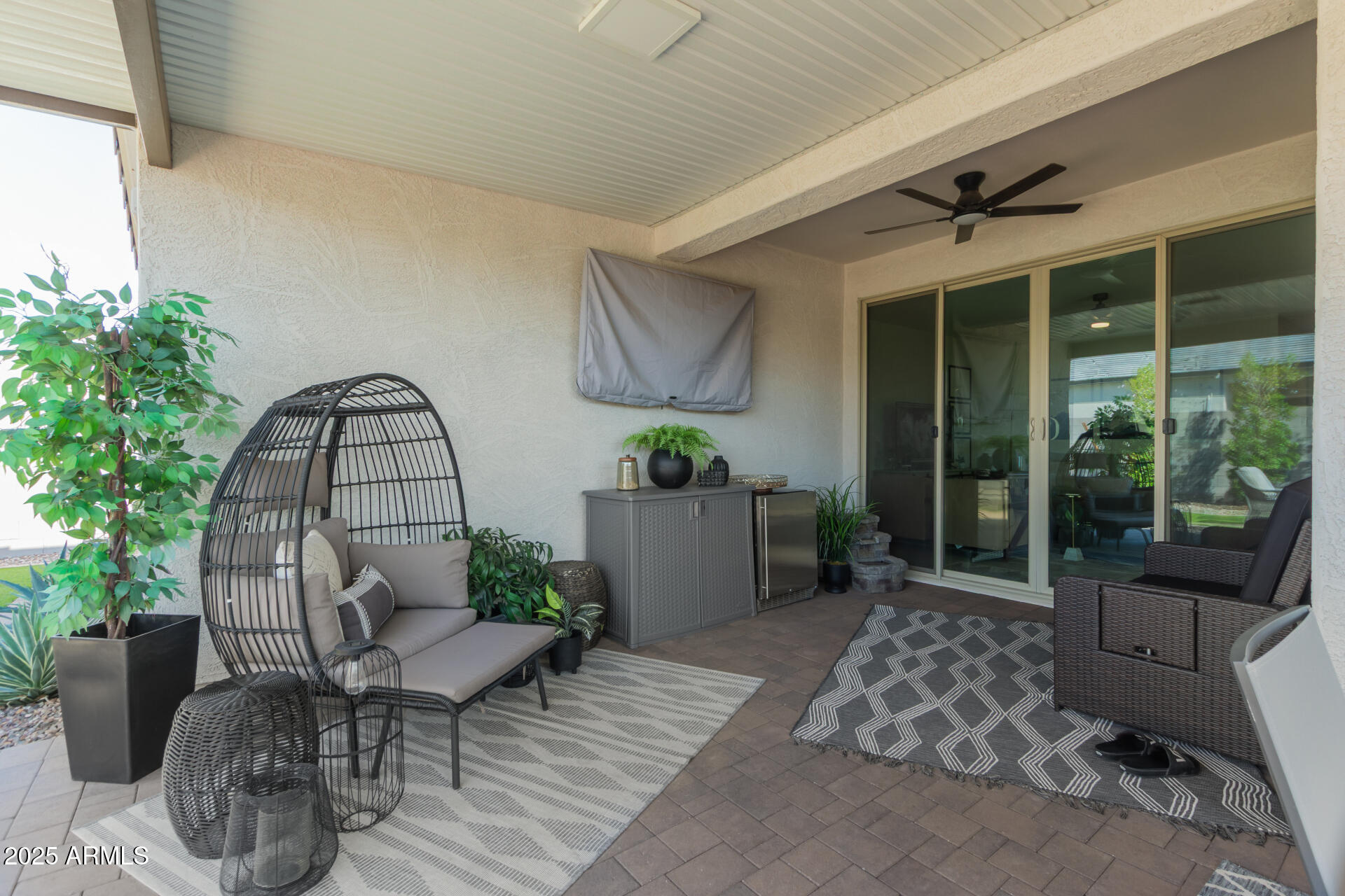 11534 East Unity Avenue Mesa, AZ 85212 - Photo 19 of 22 a view of a patio with couple of chairs and a potted plant