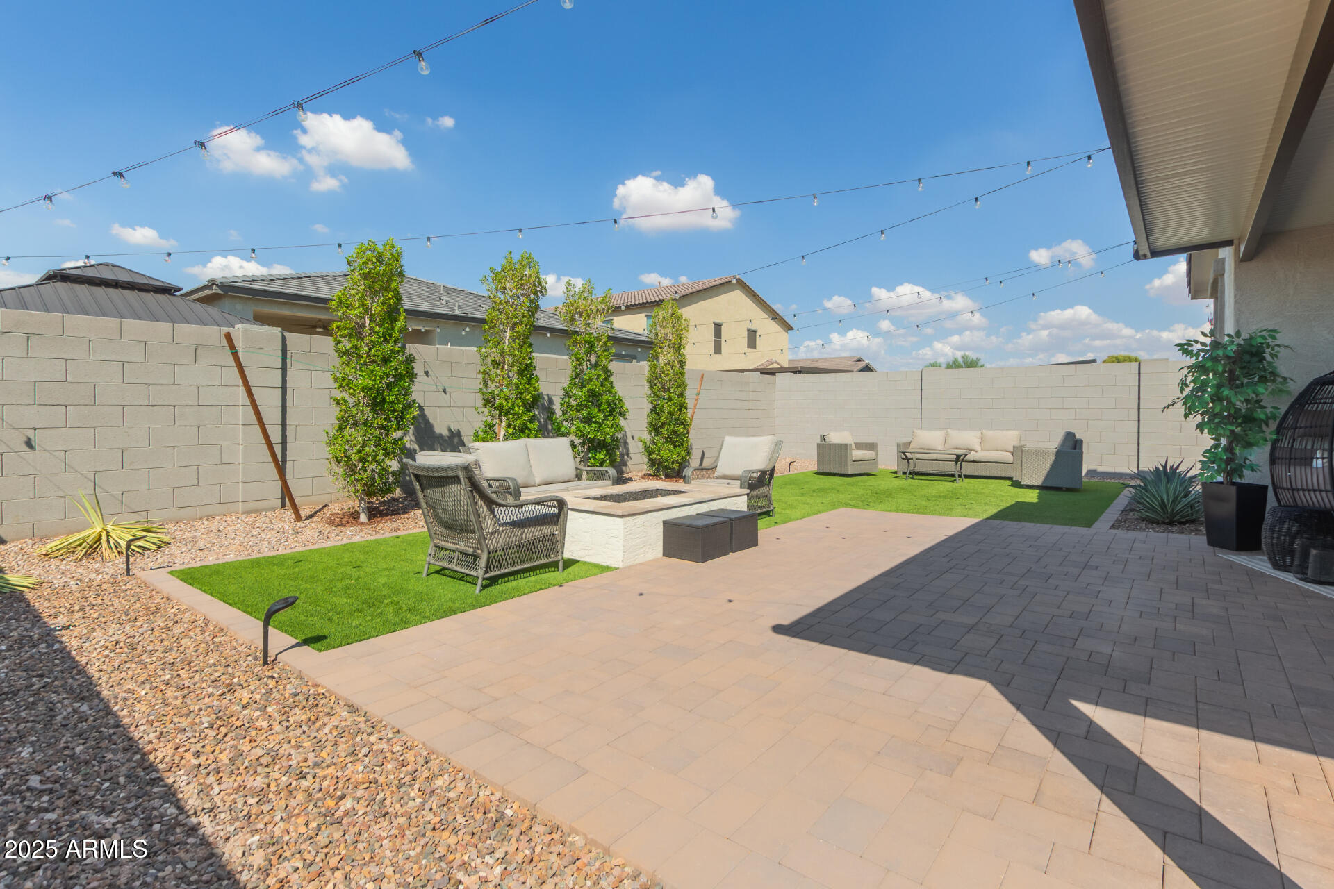 11534 East Unity Avenue Mesa, AZ 85212 - Photo 20 of 22 a view of a patio with a table and chairs
