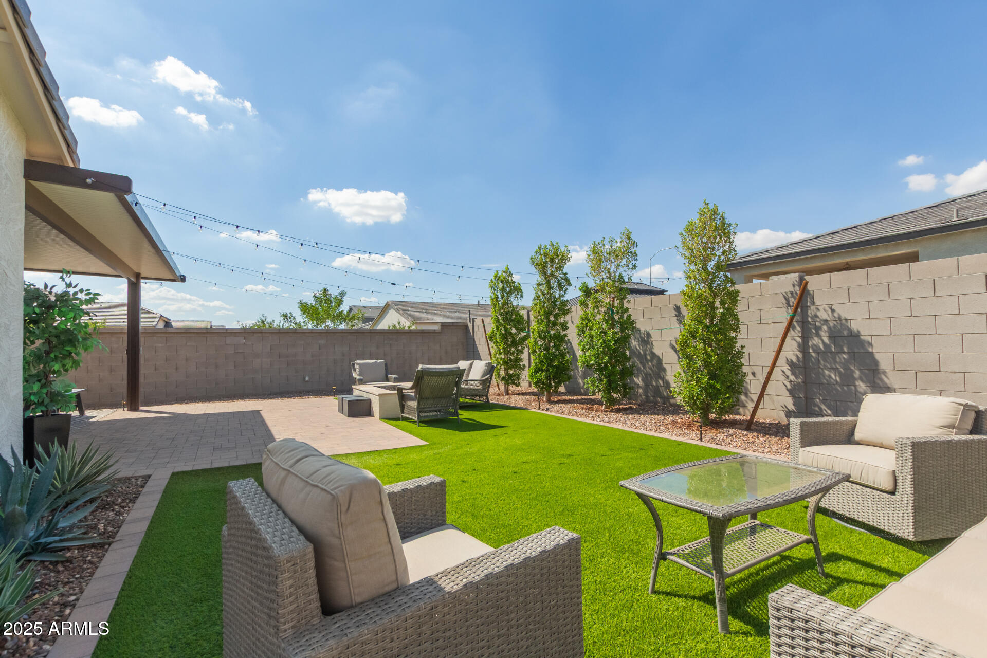 11534 East Unity Avenue Mesa, AZ 85212 - Photo 21 of 22 a view of a house with backyard sitting area and garden