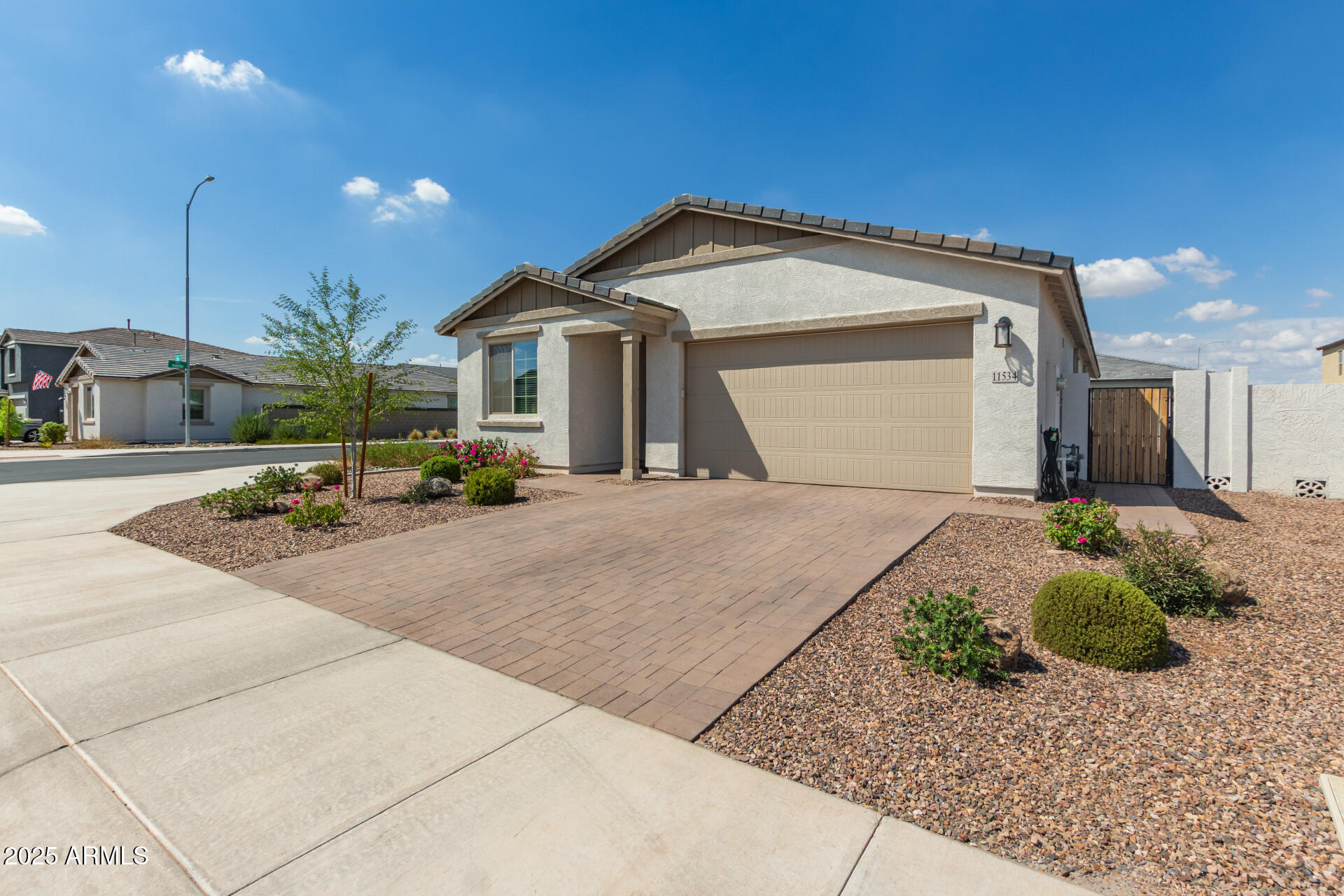 11534 East Unity Avenue Mesa, AZ 85212 - Photo 22 of 22 a front view of a house with a yard