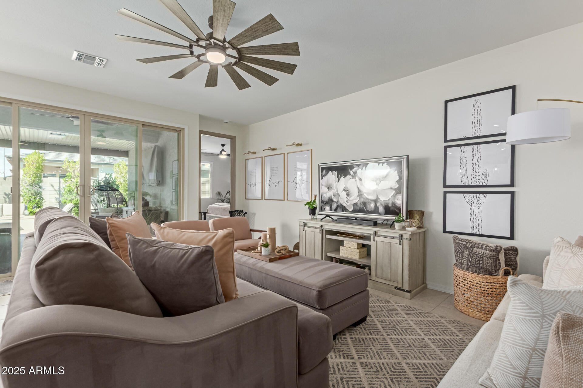 11534 East Unity Avenue Mesa, AZ 85212 - Photo 4 of 22 a living room with furniture and a flat screen tv