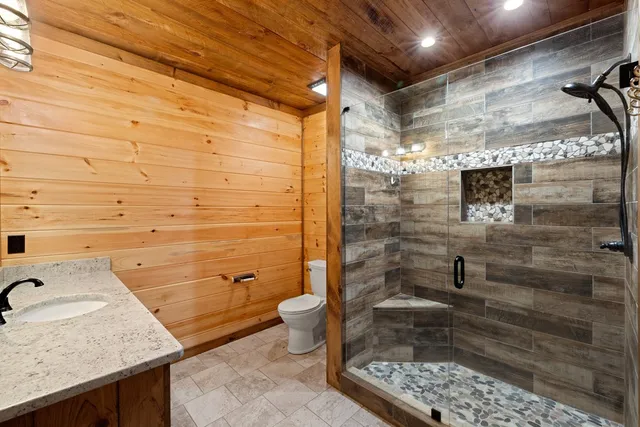 a bathroom with a glass door shower