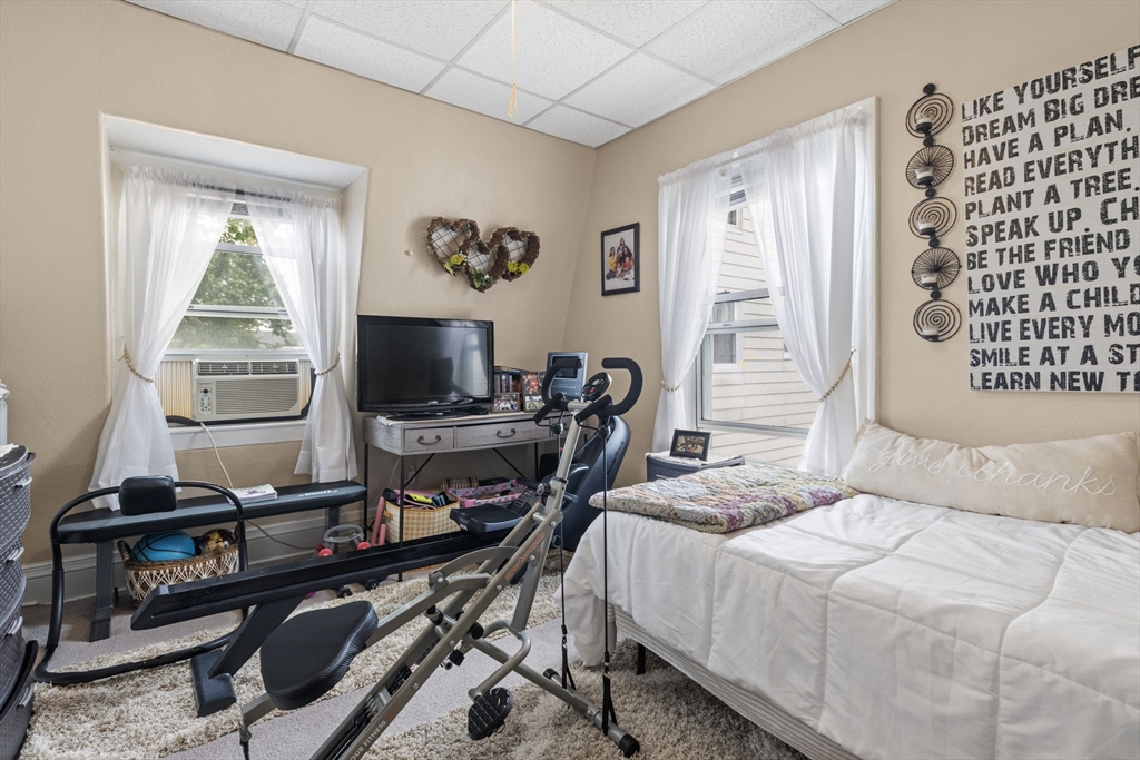 48 Ridge Street Fall River, MA 02721 - Photo 11 of 39 a bedroom with a bed and a window