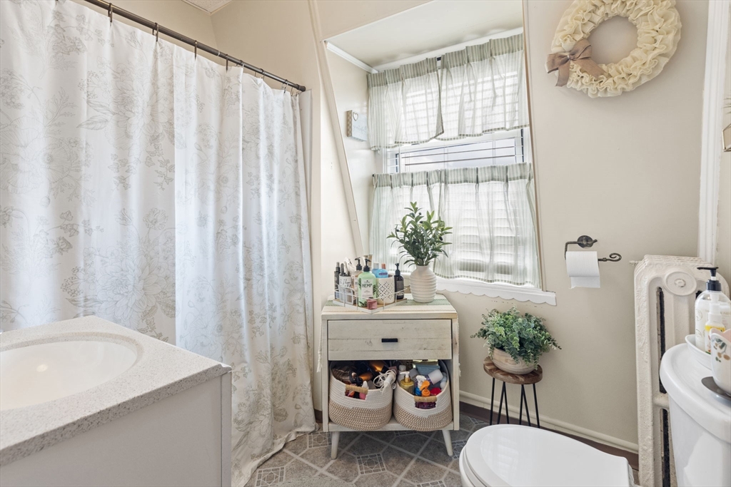 48 Ridge Street Fall River, MA 02721 - Photo 13 of 39 a bathroom with a sink toilet and shower