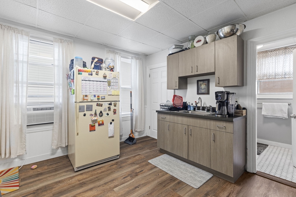 48 Ridge Street Fall River, MA 02721 - Photo 16 of 39 a kitchen with stainless steel appliances a refrigerator and a stove