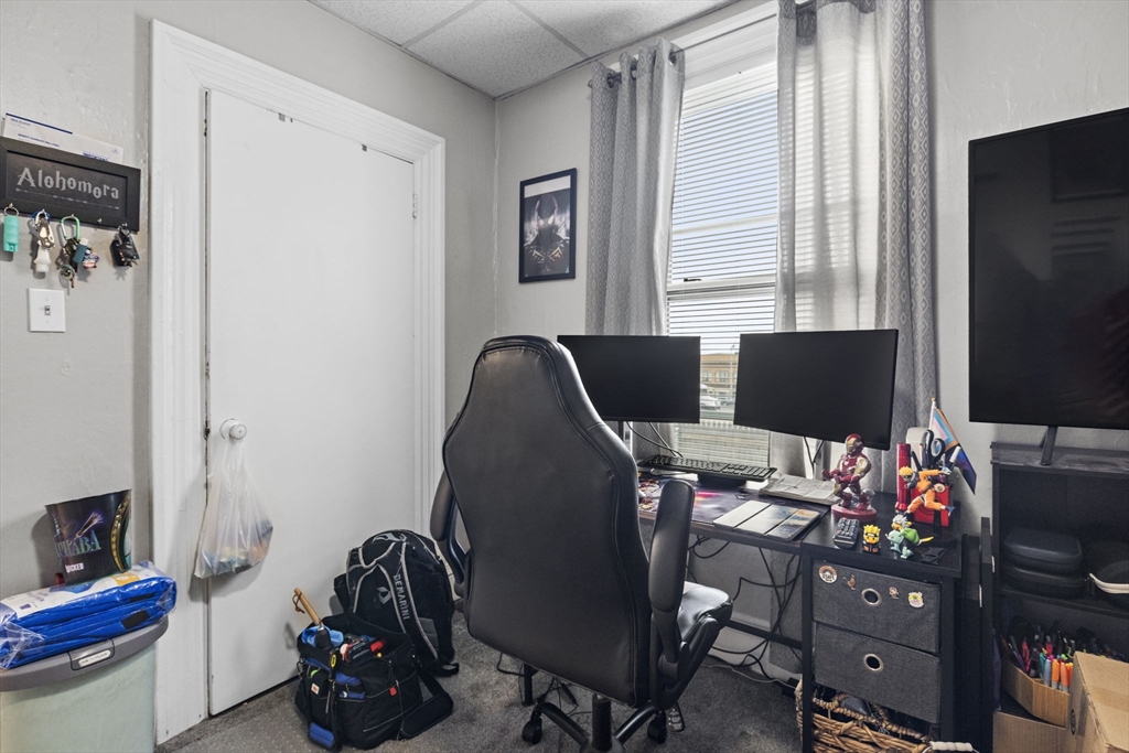 48 Ridge Street Fall River, MA 02721 - Photo 17 of 39 a room with a workspace and a window