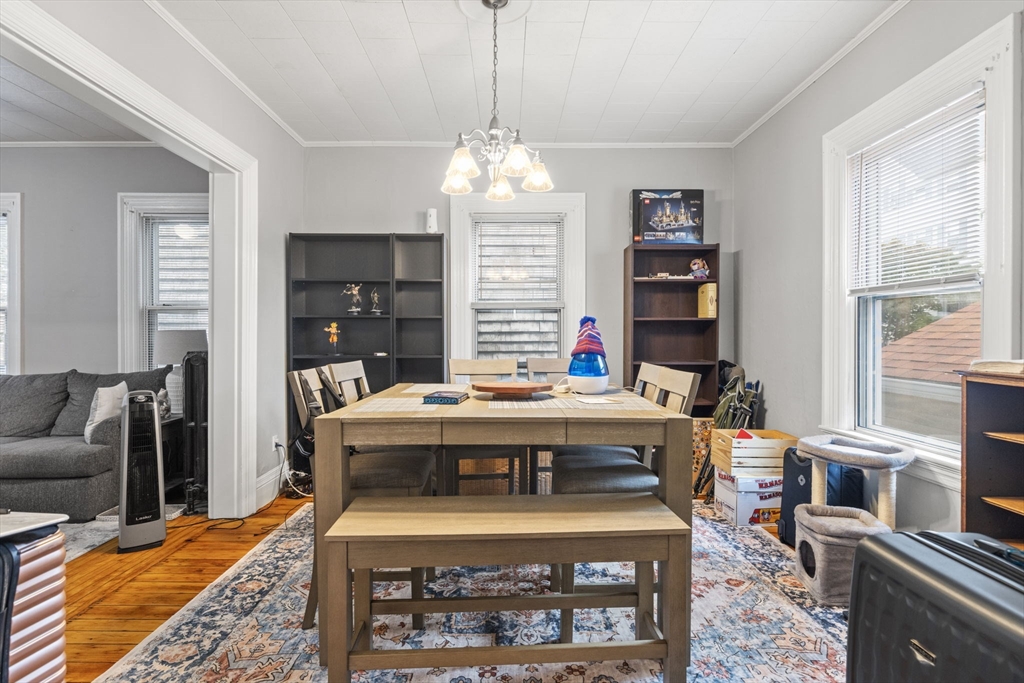 48 Ridge Street Fall River, MA 02721 - Photo 19 of 39 a view of a dining room with furniture window and wooden floor