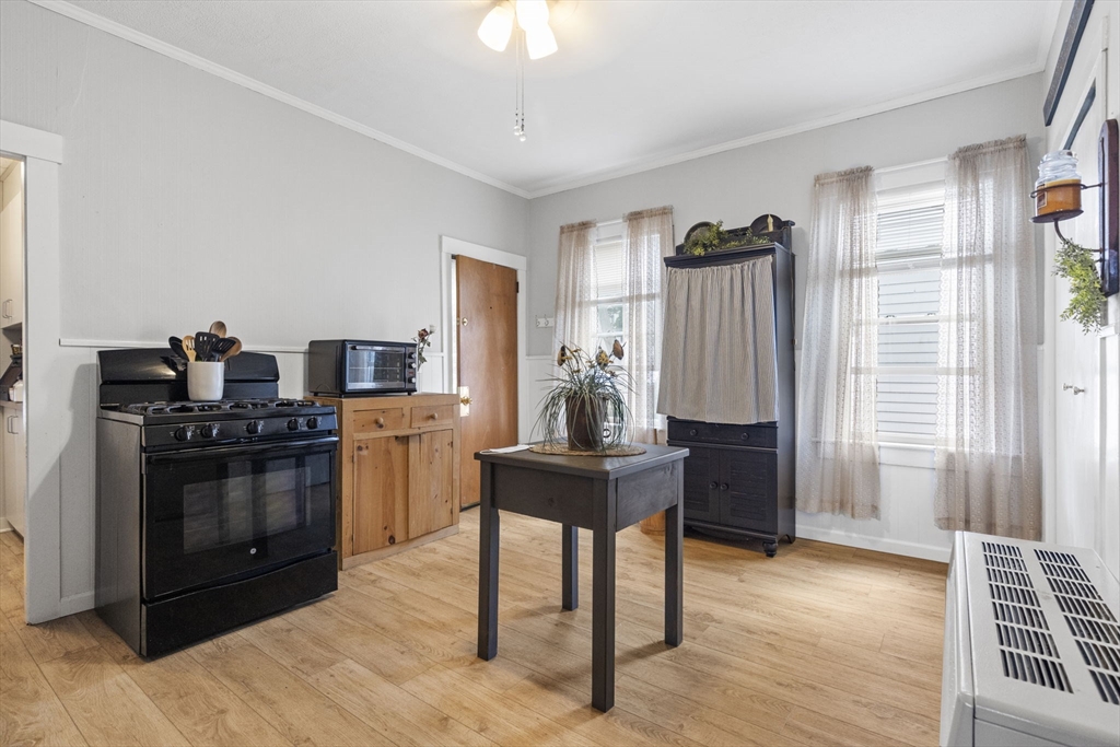 48 Ridge Street Fall River, MA 02721 - Photo 21 of 39 a kitchen with stainless steel appliances kitchen island granite countertop a refrigerator stove and sink