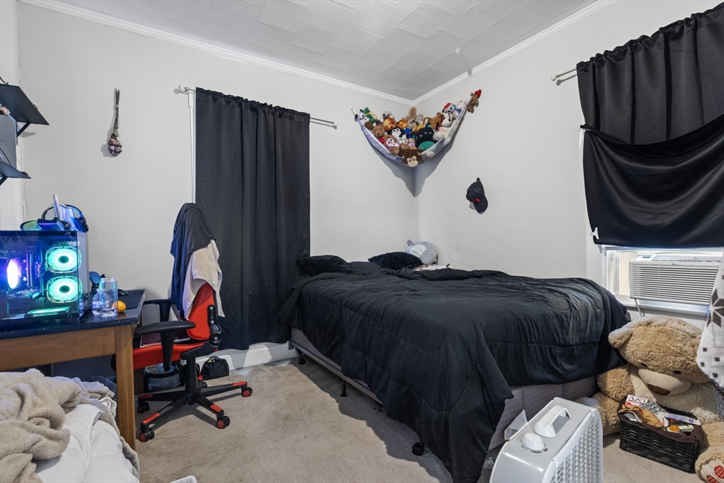 48 Ridge Street Fall River, MA 02721 - Photo 24 of 39 a bedroom with a bed and a window