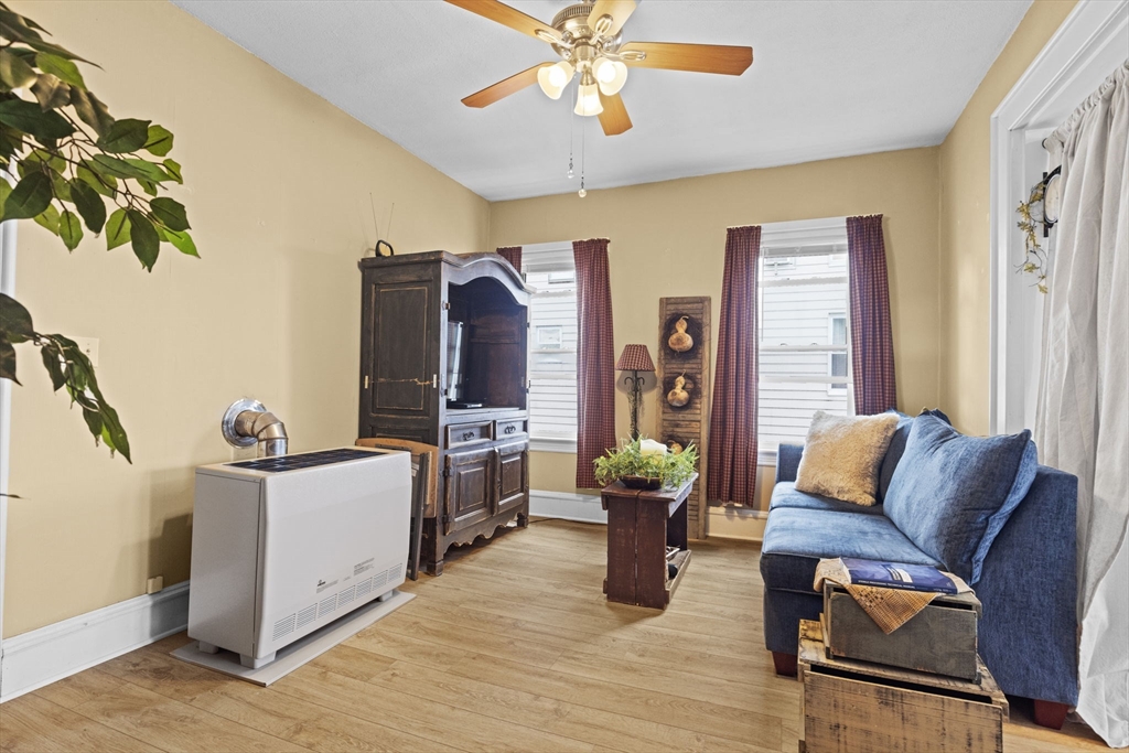 48 Ridge Street Fall River, MA 02721 - Photo 26 of 39 a living room with furniture and a flat screen tv