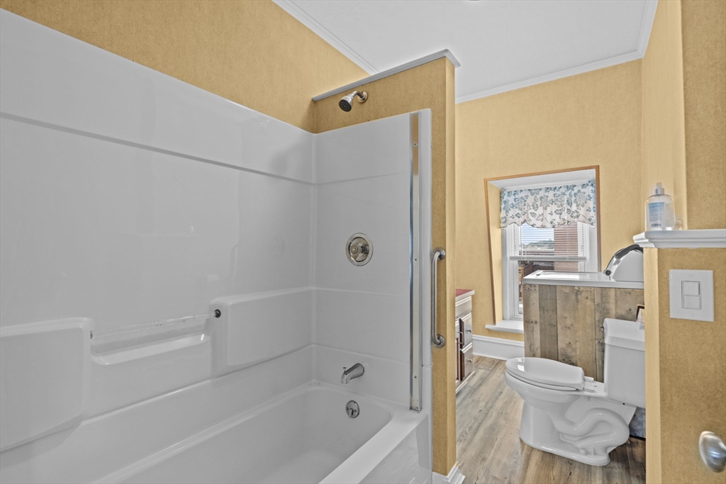 48 Ridge Street Fall River, MA 02721 - Photo 32 of 39 a bathroom with a bathtub and a shower