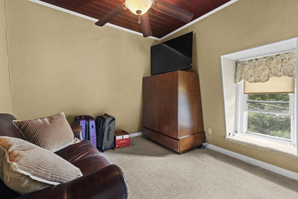 48 Ridge Street Fall River, MA 02721 - Photo 33 of 39 a living room with a couch and a window