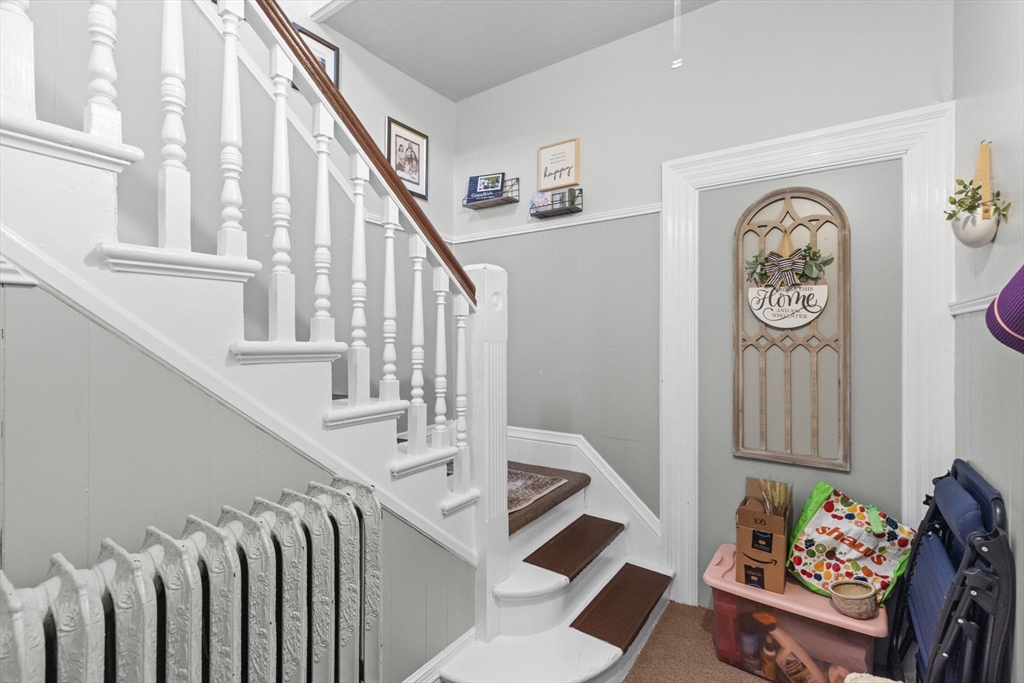 48 Ridge Street Fall River, MA 02721 - Photo 6 of 39 a view of entryway with stairs and furniture