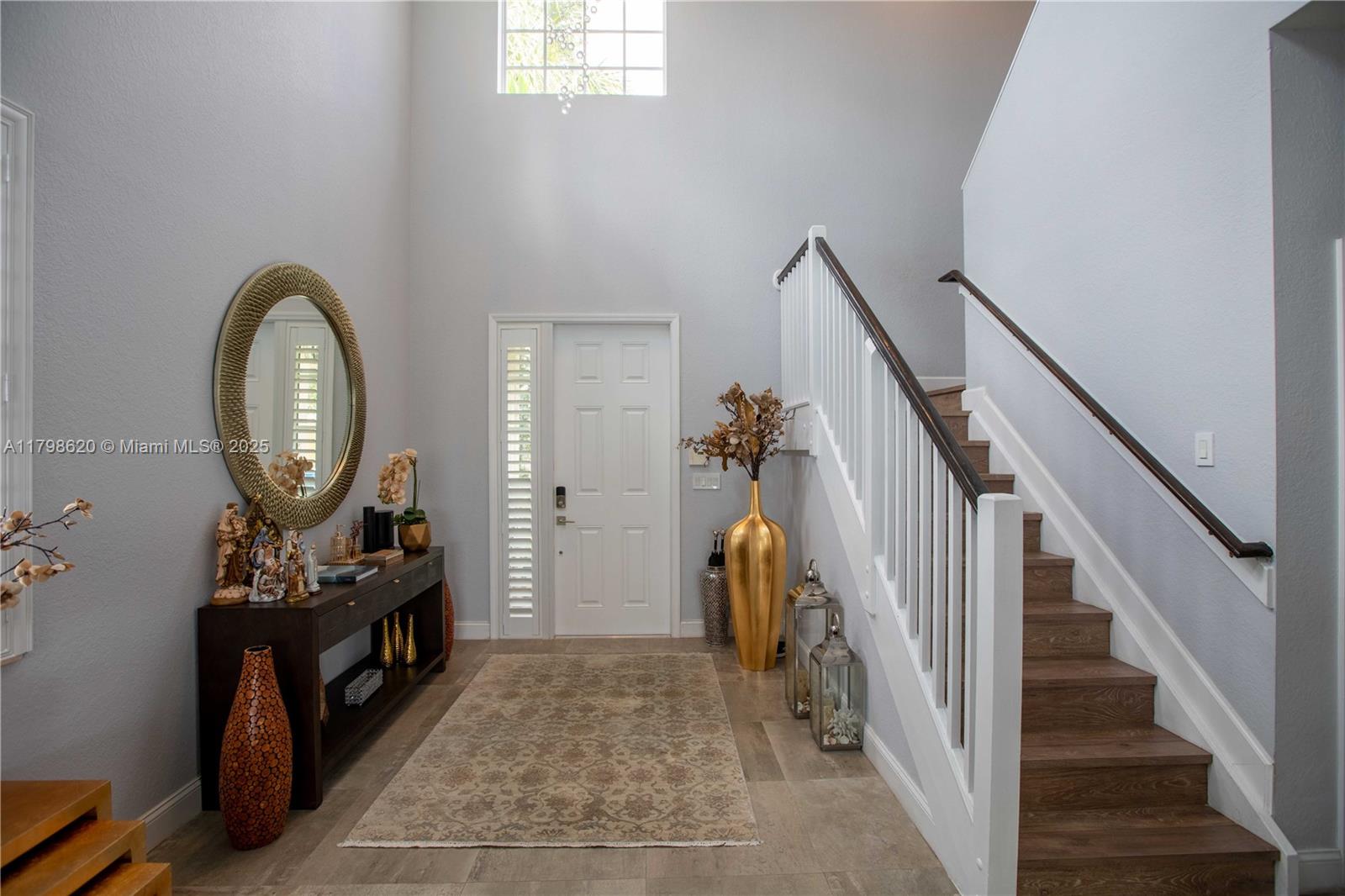 4450 Laurel Place Weston, FL 33332 - Photo 11 of 46 a view of a livingroom with furniture and staircase
