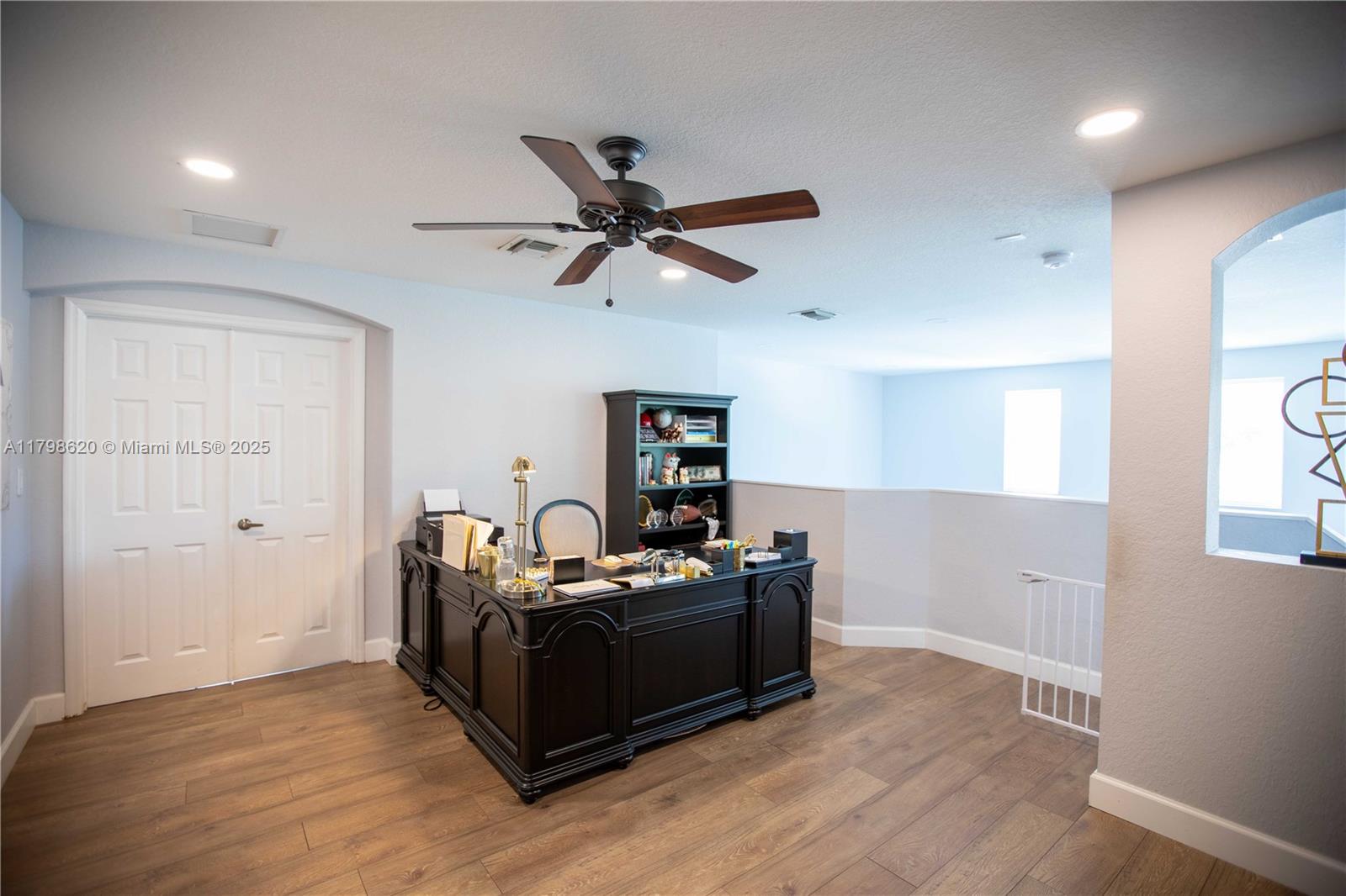 4450 Laurel Place Weston, FL 33332 - Photo 19 of 46 a living room with furniture and a wooden floor