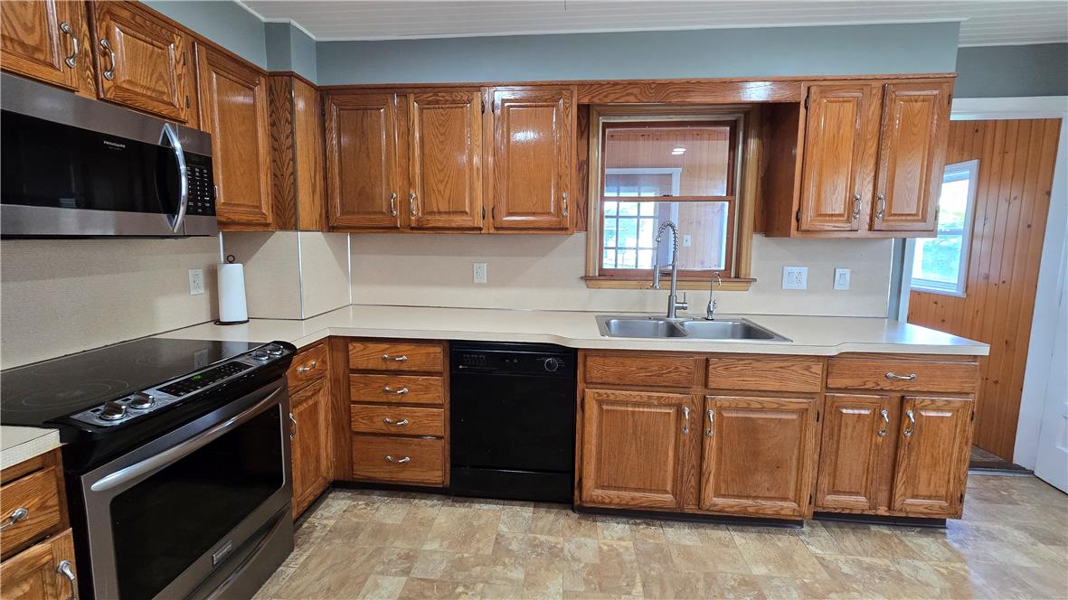 883 North Locust Street Hazleton, PA 18201 - Photo 19 of 83 A well-equipped kitchen features wooden cabinetry and modern appliances, perfect for everyday living.