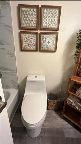 a bathroom with a toilet and a sink