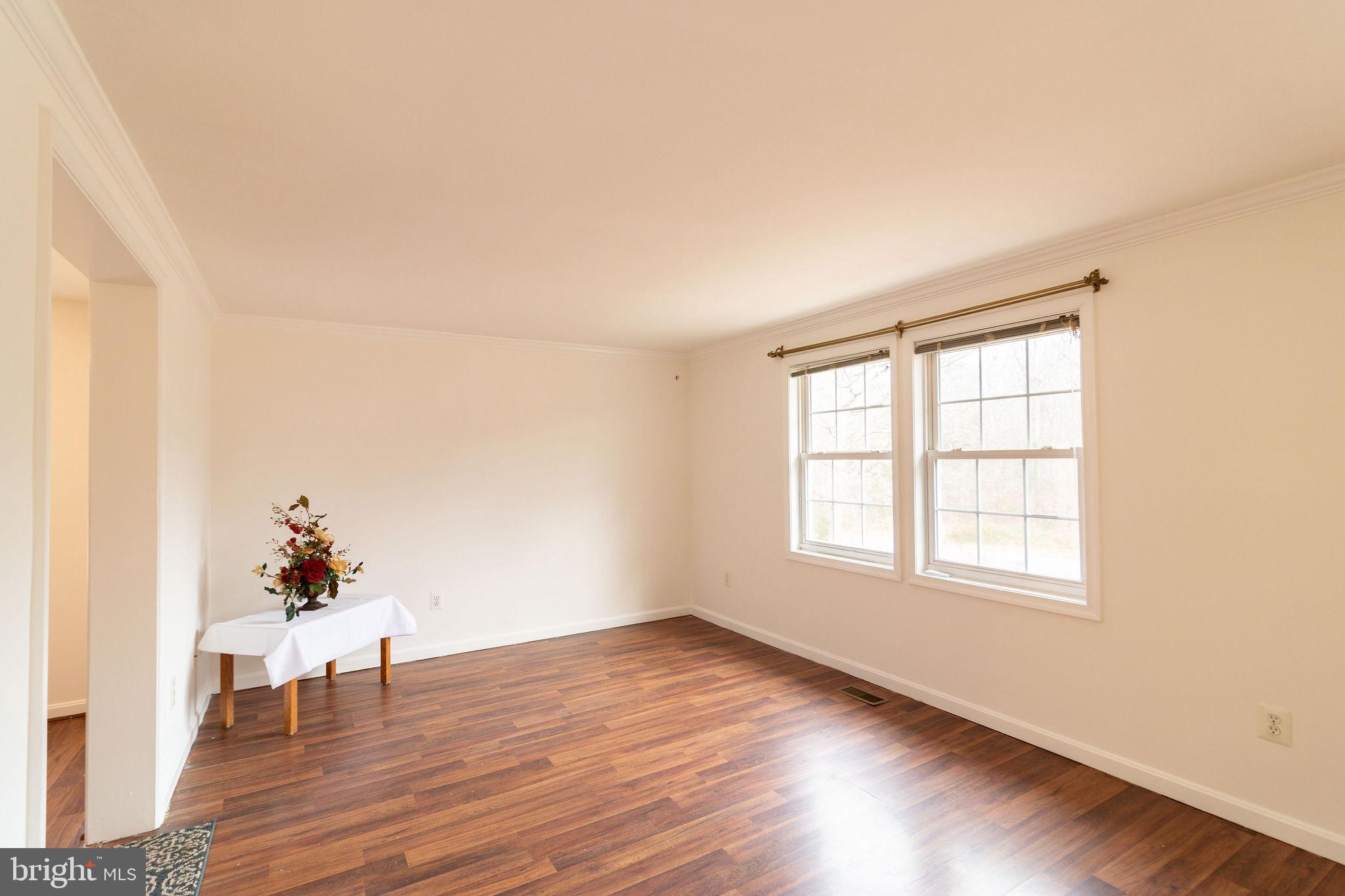 16 Eley Road Fredericksburg, VA 22406 - Photo 11 of 16 an empty room with wooden floor and windows